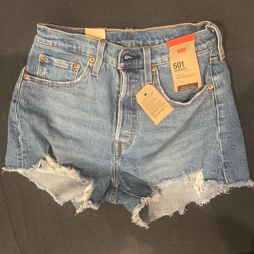 Levi 501 shorts. Never worn size 27, high rise and fitted through the hip